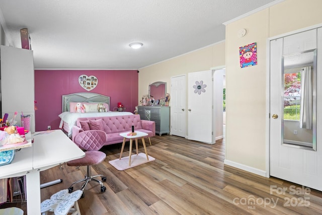 4375 Fox Rd, Lenoir, NC 28645 - bedroom with crown molding, wood finished floors, a textured ceiling, and baseboards