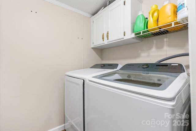 4375 Fox Rd, Lenoir, NC 28645 - laundry area featuring cabinet space, washer and clothes dryer, and crown molding