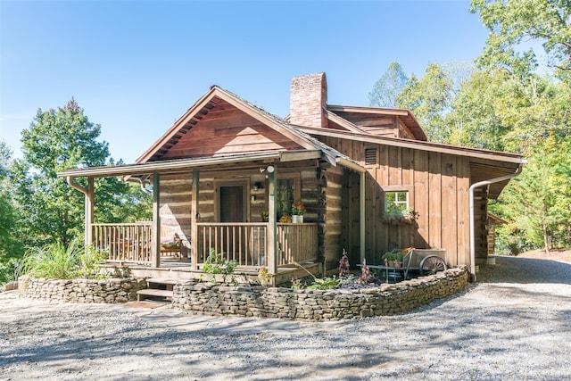 30 Wagon Mountain Dr, Weaverville, NC 28787 - cabin featuring a chimney and covered porch