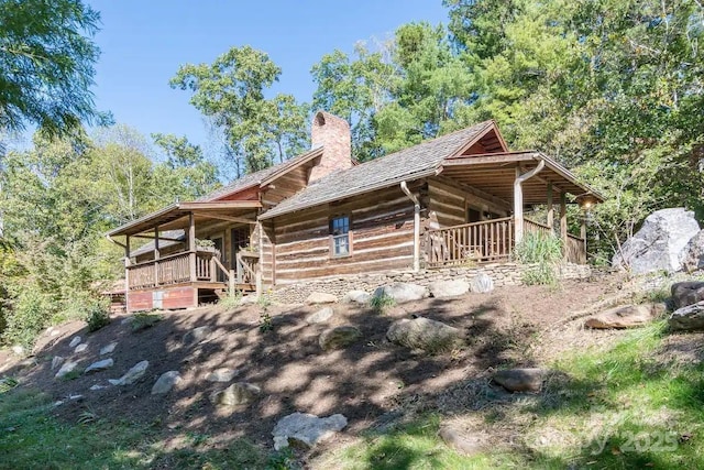 30 Wagon Mountain Dr, Weaverville, NC 28787 - view of front of house with a chimney and log siding