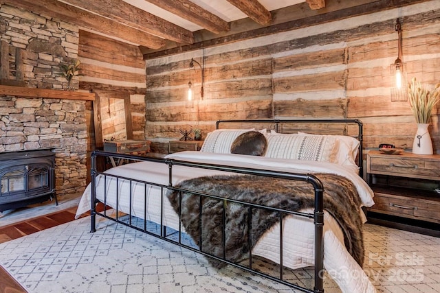 30 Wagon Mountain Dr, Weaverville, NC 28787 - bedroom with wood walls, beamed ceiling, a wood stove, and wood finished floors