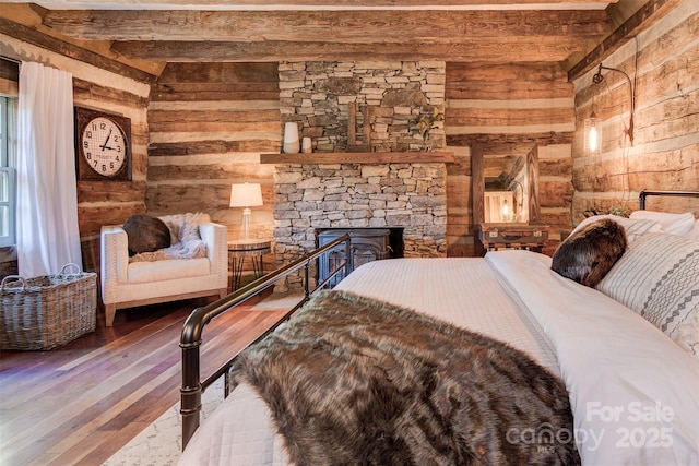 30 Wagon Mountain Dr, Weaverville, NC 28787 - bedroom featuring wooden walls, hardwood / wood-style floors, beam ceiling, and a stone fireplace
