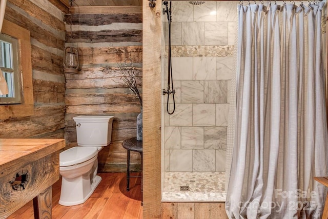 30 Wagon Mountain Dr, Weaverville, NC 28787 - bathroom with wood finished floors, a stall shower, wooden walls, and vanity