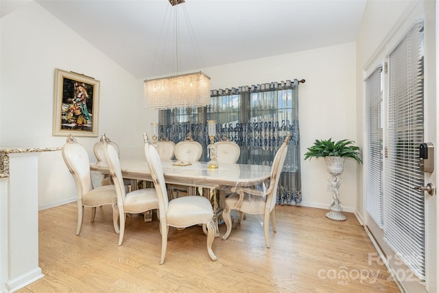 12822 Plumleaf Dr, Charlotte, NC 28213 - dining room featuring wood finished floors, a chandelier, and baseboards
