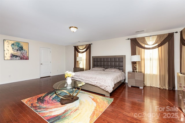 12822 Plumleaf Dr, Charlotte, NC 28213 - bedroom featuring wood finished floors and baseboards