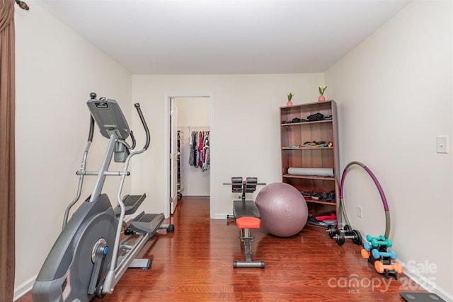 12822 Plumleaf Dr, Charlotte, NC 28213 - workout area with wood finished floors and baseboards