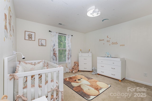 12822 Plumleaf Dr, Charlotte, NC 28213 - bedroom featuring a crib, light colored carpet, and baseboards