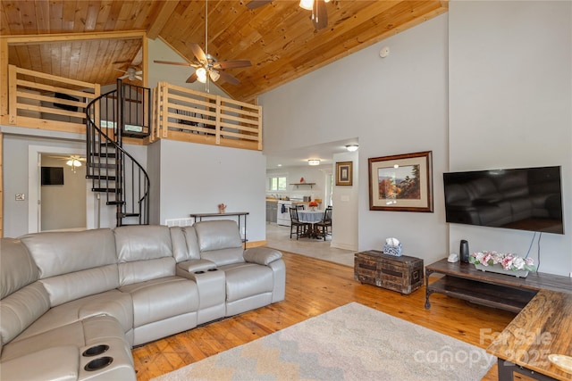 223 Smith Cove Rd, Candler, NC 28715 - living room with a ceiling fan, wood ceiling with exposed beams, high vaulted ceiling, wood finished floors, and stairs