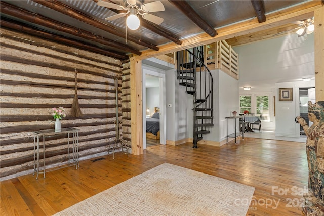 223 Smith Cove Rd, Candler, NC 28715 - entrance foyer with stairway, a ceiling fan, hardwood / wood-style floors, and beam ceiling