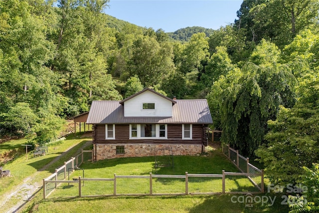 223 Smith Cove Rd, Candler, NC 28715 - view of front of property featuring a wooded view, metal roof, a gate, and stone siding