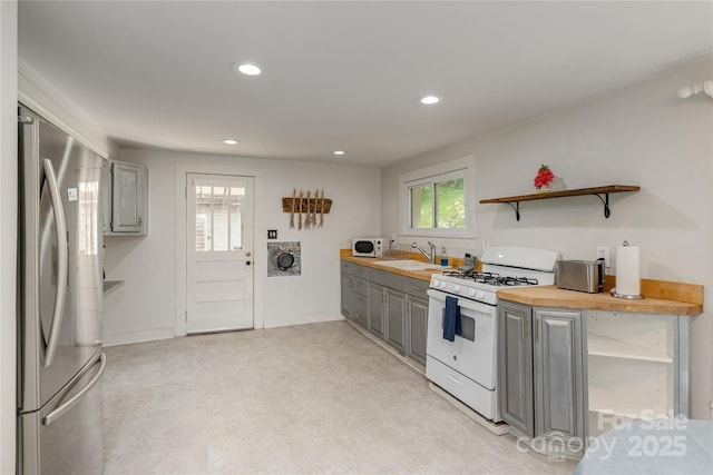 223 Smith Cove Rd, Candler, NC 28715 - kitchen featuring white appliances, gray cabinetry, open shelves, recessed lighting, and a sink