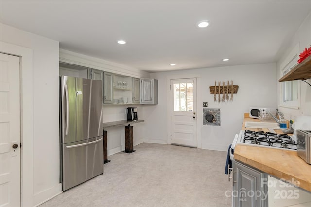 223 Smith Cove Rd, Candler, NC 28715 - kitchen with freestanding refrigerator, wooden counters, open shelves, gray cabinetry, and recessed lighting