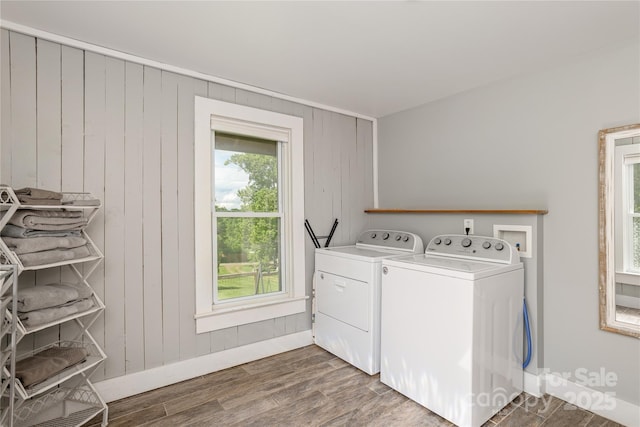 223 Smith Cove Rd, Candler, NC 28715 - laundry room with washer and dryer, baseboards, wood finished floors, and wood walls
