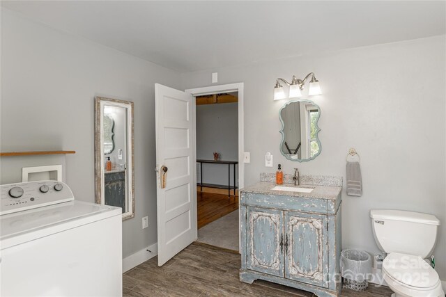 223 Smith Cove Rd, Candler, NC 28715 - washroom featuring washer / clothes dryer and wood finished floors