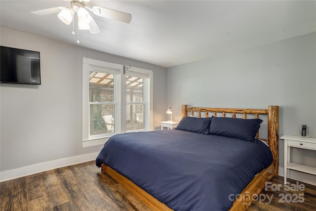 223 Smith Cove Rd, Candler, NC 28715 - bedroom featuring wood finished floors, baseboards, and a ceiling fan