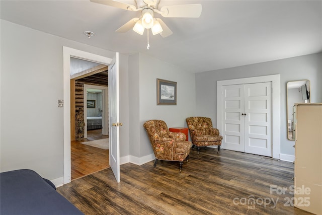 223 Smith Cove Rd, Candler, NC 28715 - living area featuring wood finished floors, a ceiling fan, and baseboards