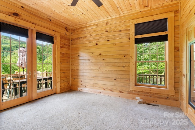 148 Pearl Way, Burnsville, NC 28714 - carpeted spare room with wooden walls, wooden ceiling, and ceiling fan