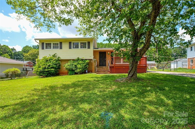 923 Yuma St, Charlotte, NC 28213 - split level home with brick siding and a wooden deck