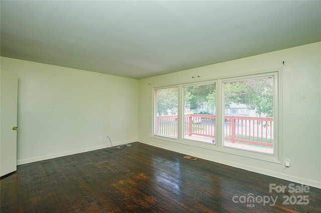 923 Yuma St, Charlotte, NC 28213 - spare room featuring dark wood finished floors and baseboards