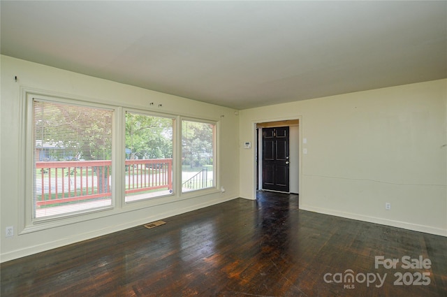 923 Yuma St, Charlotte, NC 28213 - unfurnished room with dark wood finished floors and baseboards