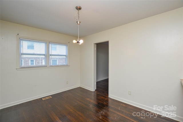 923 Yuma St, Charlotte, NC 28213 - empty room with wood finished floors and baseboards