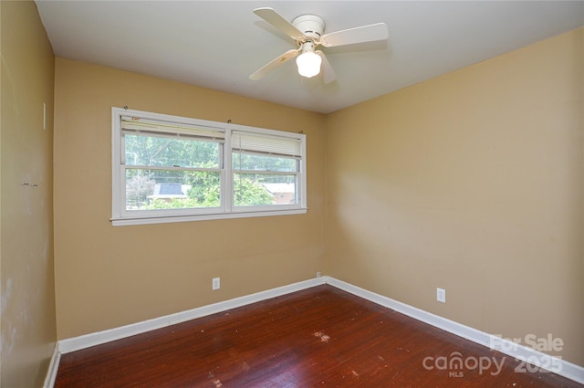 923 Yuma St, Charlotte, NC 28213 - empty room with baseboards, dark wood-type flooring, and a ceiling fan