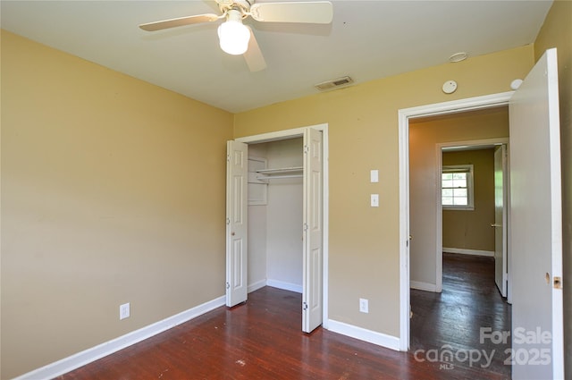 923 Yuma St, Charlotte, NC 28213 - unfurnished bedroom with wood finished floors, baseboards, a closet, and a ceiling fan