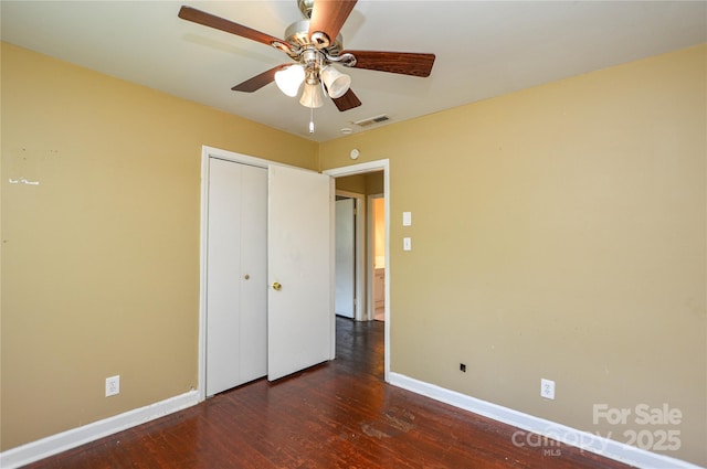 923 Yuma St, Charlotte, NC 28213 - unfurnished bedroom with baseboards, wood finished floors, a closet, and ceiling fan
