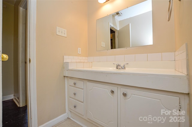 923 Yuma St, Charlotte, NC 28213 - bathroom with vanity, backsplash, and baseboards