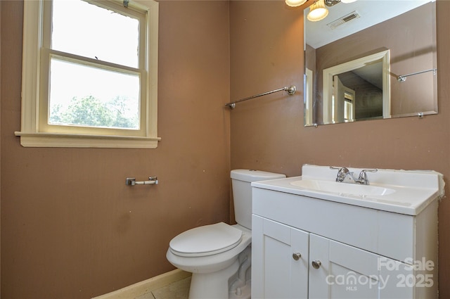 923 Yuma St, Charlotte, NC 28213 - half bath with toilet, vanity, baseboards, and tile patterned floors
