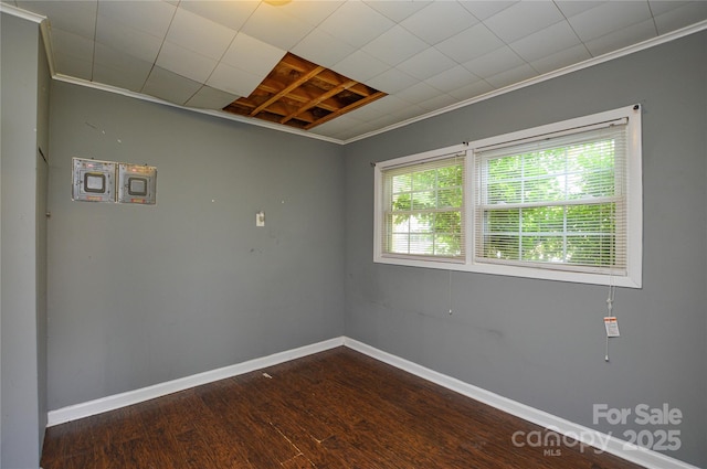 923 Yuma St, Charlotte, NC 28213 - spare room featuring crown molding, wood finished floors, and baseboards