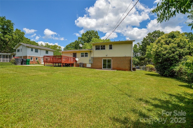 923 Yuma St, Charlotte, NC 28213 - rear view of house with a wooden deck, a yard, and brick siding
