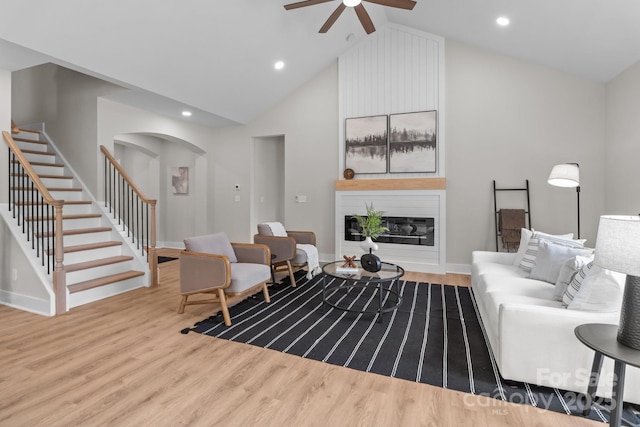 4949 Rimer Rd Unit 4, Concord, NC 28025 - living area with ceiling fan, stairway, arched walkways, wood finished floors, and lofted ceiling