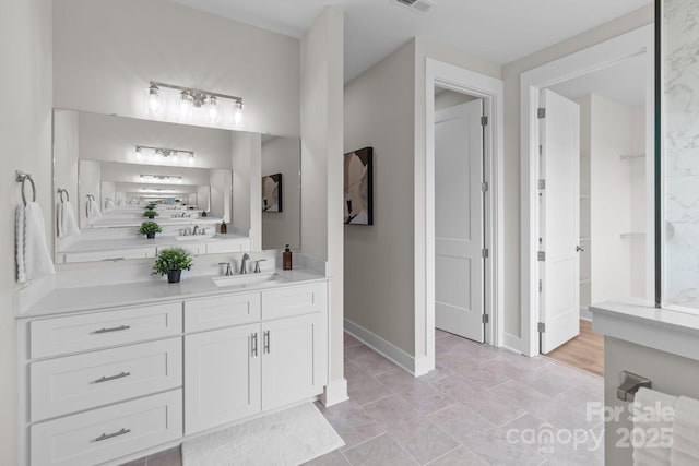 4949 Rimer Rd Unit 4, Concord, NC 28025 - bathroom featuring vanity and baseboards