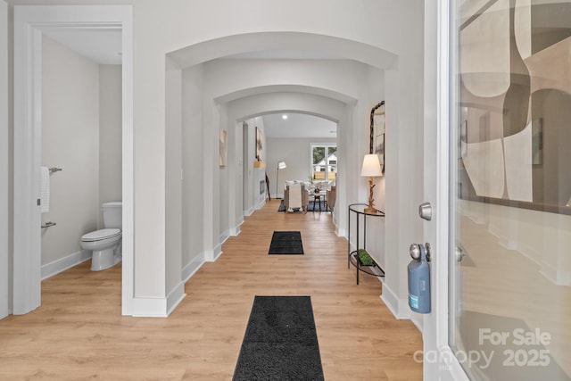 4949 Rimer Rd Unit 4, Concord, NC 28025 - entrance foyer featuring arched walkways, light wood-style flooring, and baseboards