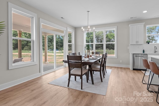 4949 Rimer Rd Unit 4, Concord, NC 28025 - dining area featuring light wood-style flooring, a chandelier, baseboards, and recessed lighting