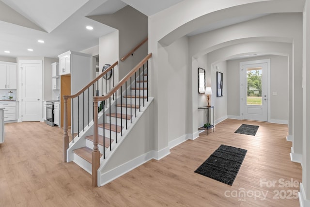 4949 Rimer Rd Unit 4, Concord, NC 28025 - foyer with recessed lighting, light wood-type flooring, arched walkways, stairway, and baseboards
