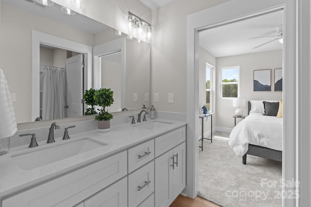 4949 Rimer Rd Unit 4, Concord, NC 28025 - ensuite bathroom featuring double vanity, ceiling fan, and baseboards