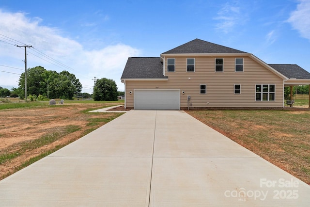 4949 Rimer Rd Unit 4, Concord, NC 28025 - view of side of home with concrete driveway, a lawn, and roof with shingles
