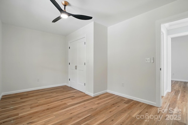 251 Hall Ave NW, Concord, NC 28027 - spare room with a ceiling fan, light wood finished floors, baseboards, and ornamental molding