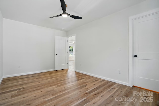 251 Hall Ave NW, Concord, NC 28027 - empty room with light wood finished floors, a ceiling fan, and baseboards