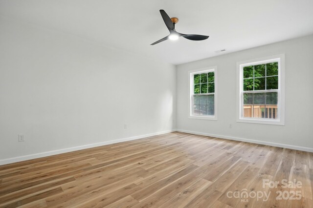 251 Hall Ave NW, Concord, NC 28027 - unfurnished room featuring light wood-type flooring, a ceiling fan, and baseboards