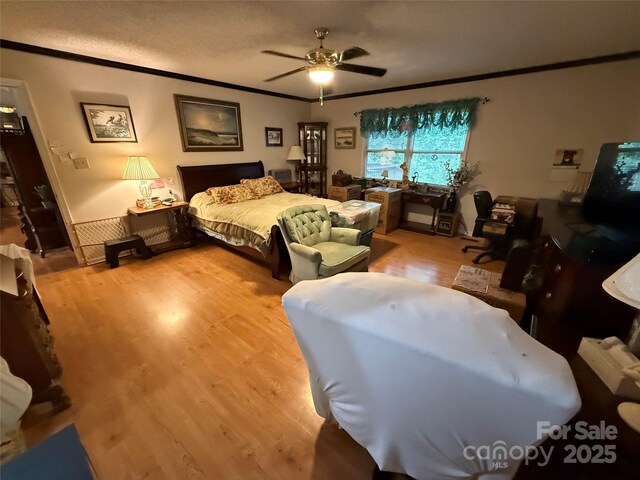 5198 Wright Dr, Hickory, NC 28602 - bedroom featuring ornamental molding, light wood-type flooring, and a ceiling fan