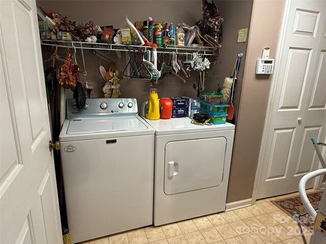 5198 Wright Dr, Hickory, NC 28602 - laundry area featuring washer and clothes dryer and light tile patterned floors