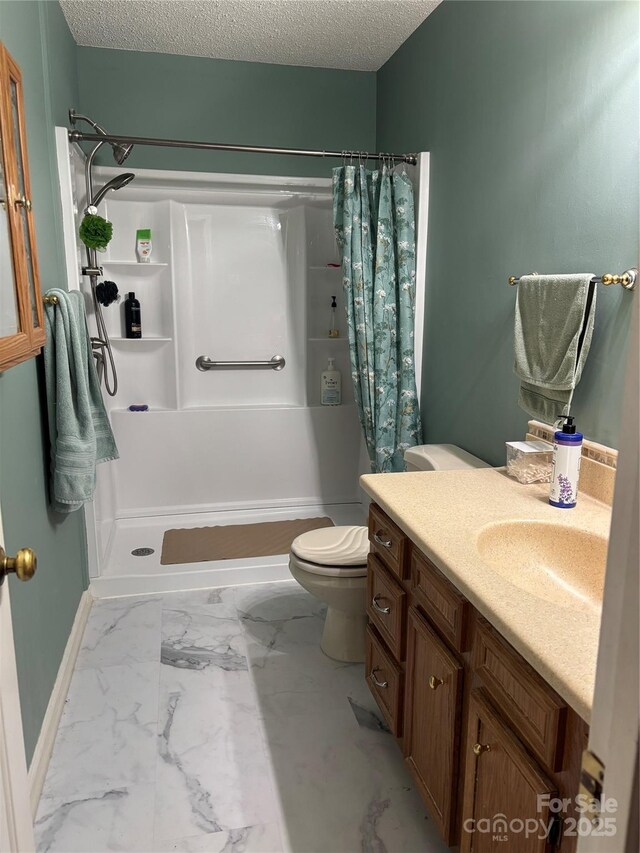 5198 Wright Dr, Hickory, NC 28602 - bathroom with marble look tiles, a shower with shower curtain, vanity, toilet, and a textured ceiling