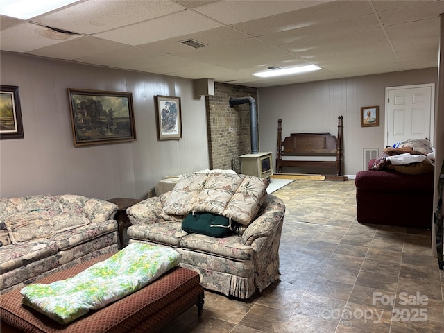 5198 Wright Dr, Hickory, NC 28602 - living area with a wood stove and a paneled ceiling