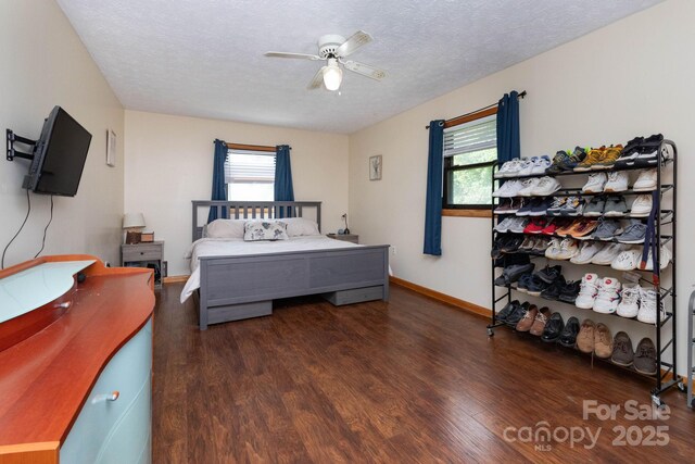 15 Gaddy Rd, Weaverville, NC 28787 - bedroom with wood finished floors, multiple windows, a textured ceiling, and ceiling fan