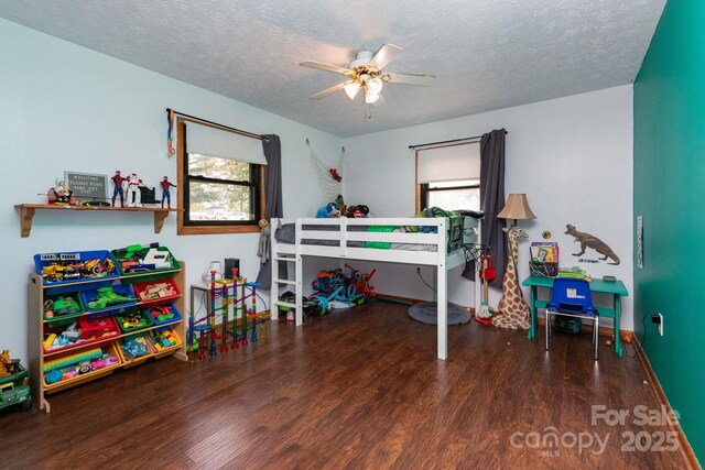 15 Gaddy Rd, Weaverville, NC 28787 - bedroom with wood finished floors and a textured ceiling