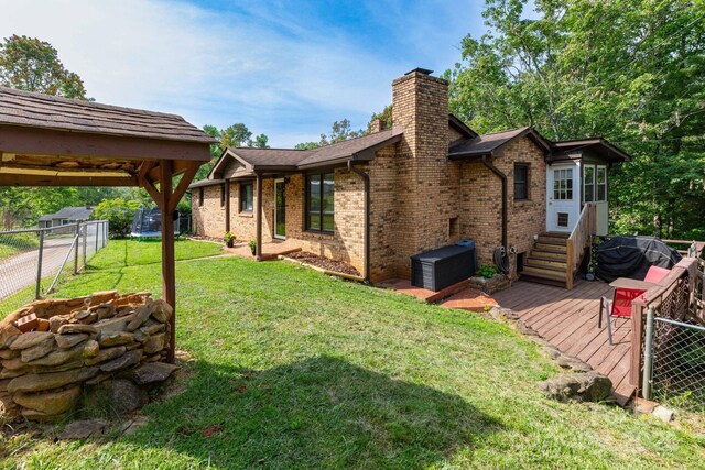 15 Gaddy Rd, Weaverville, NC 28787 - back of property with a chimney, brick siding, and a wooden deck