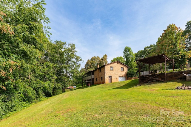 15 Gaddy Rd, Weaverville, NC 28787 - view of grassy yard with an attached garage